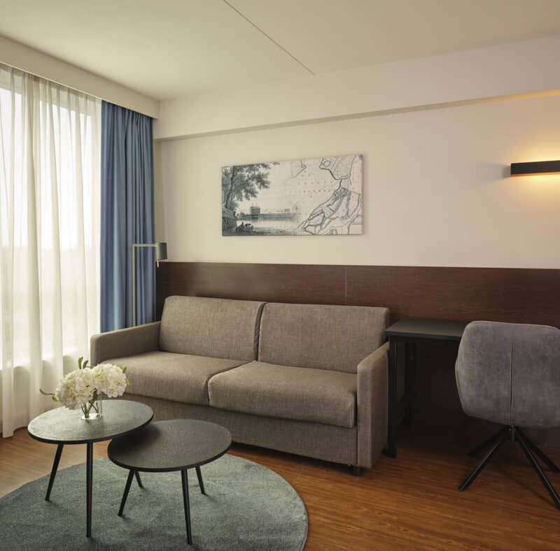 Pull out sofa with 2 black coffee tables, desk and velvet chair